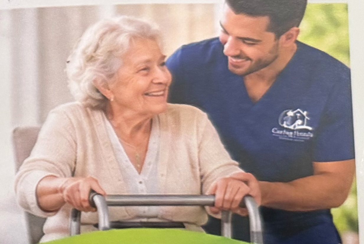 A caregiver helping a senior woman with her walker